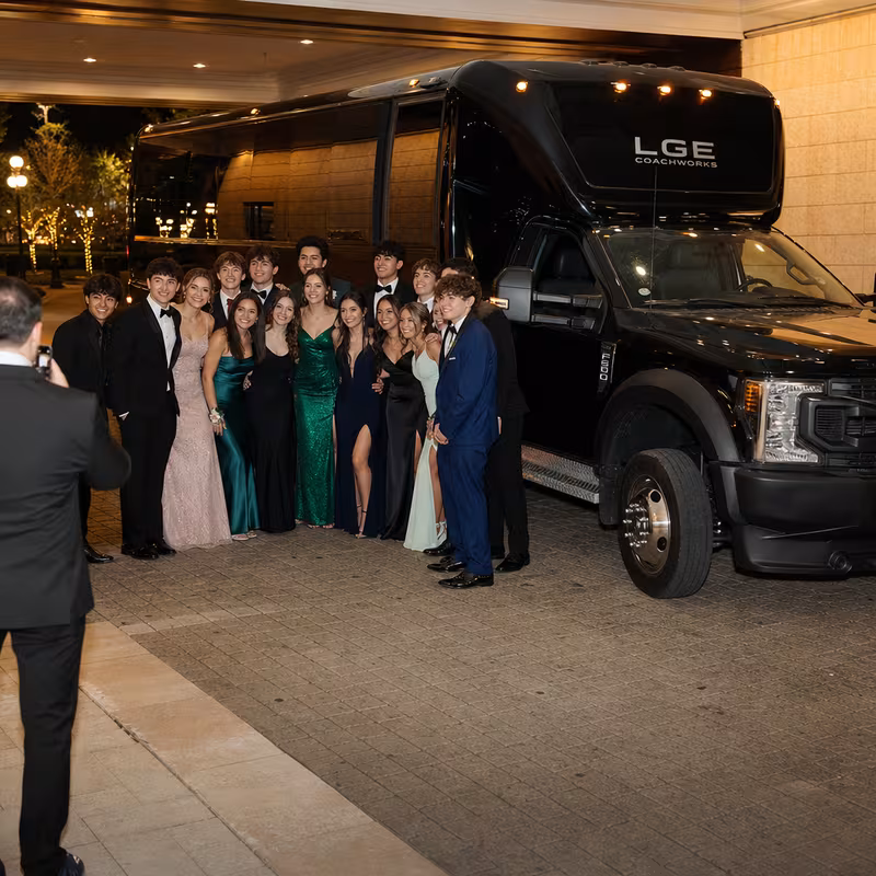 Party bus interior with wraparound leather seating and LED lighting in Elizabeth