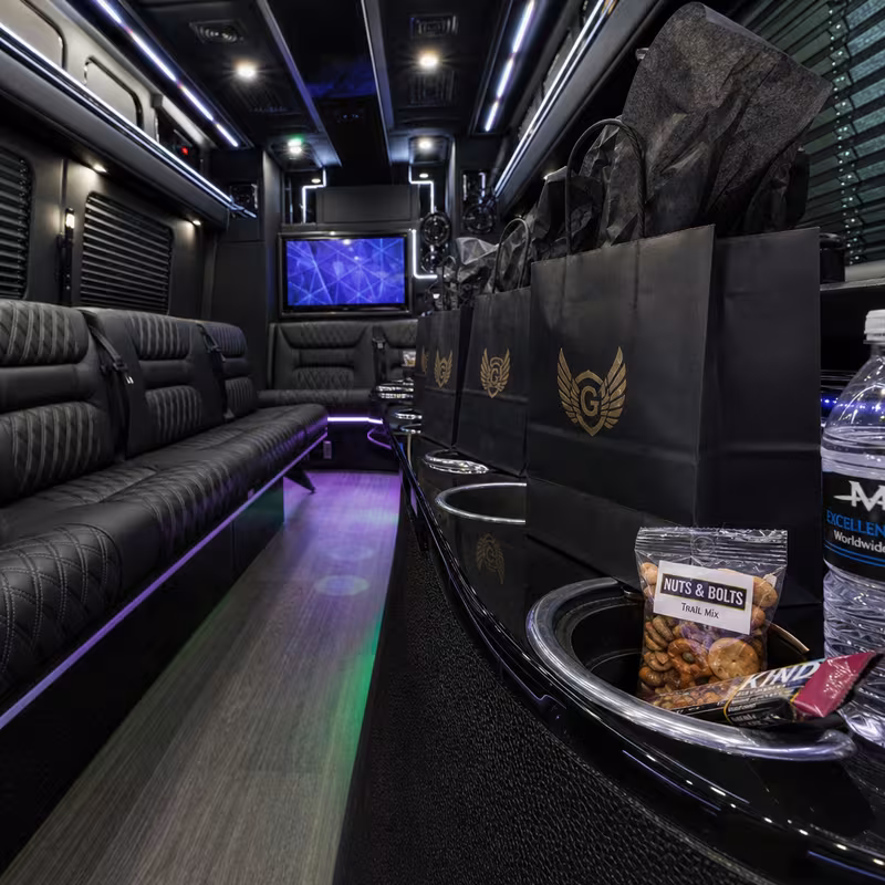 Party bus interior with wraparound leather seating and LED lighting in Elizabeth